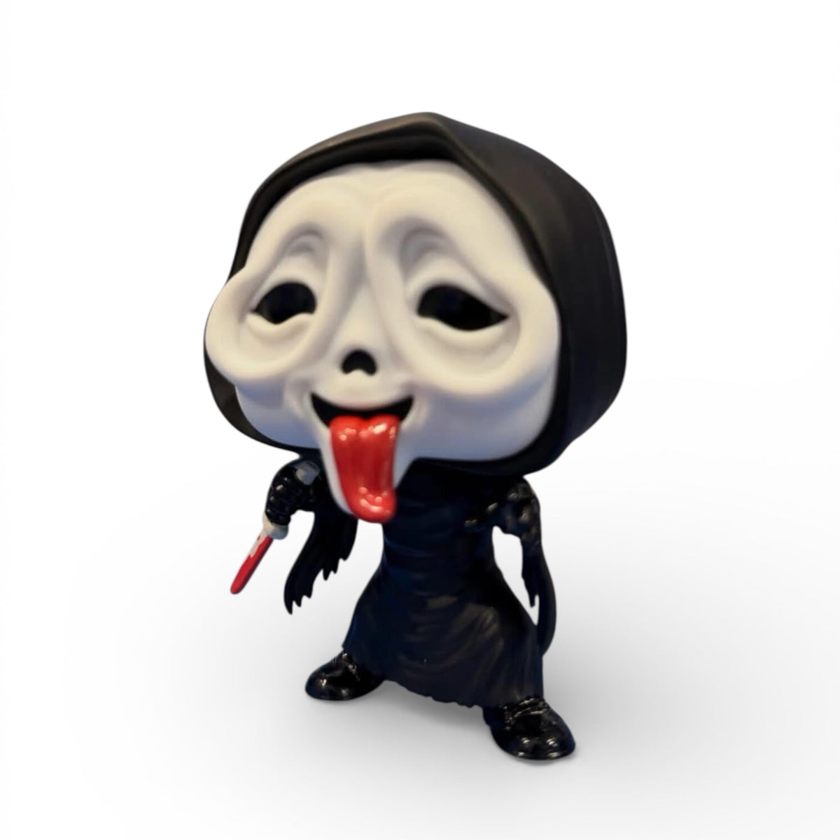 Funko Ghost Face with Tongue Funko Pop! vinyl figure, collectible horror character with expressive face and tongue detail.